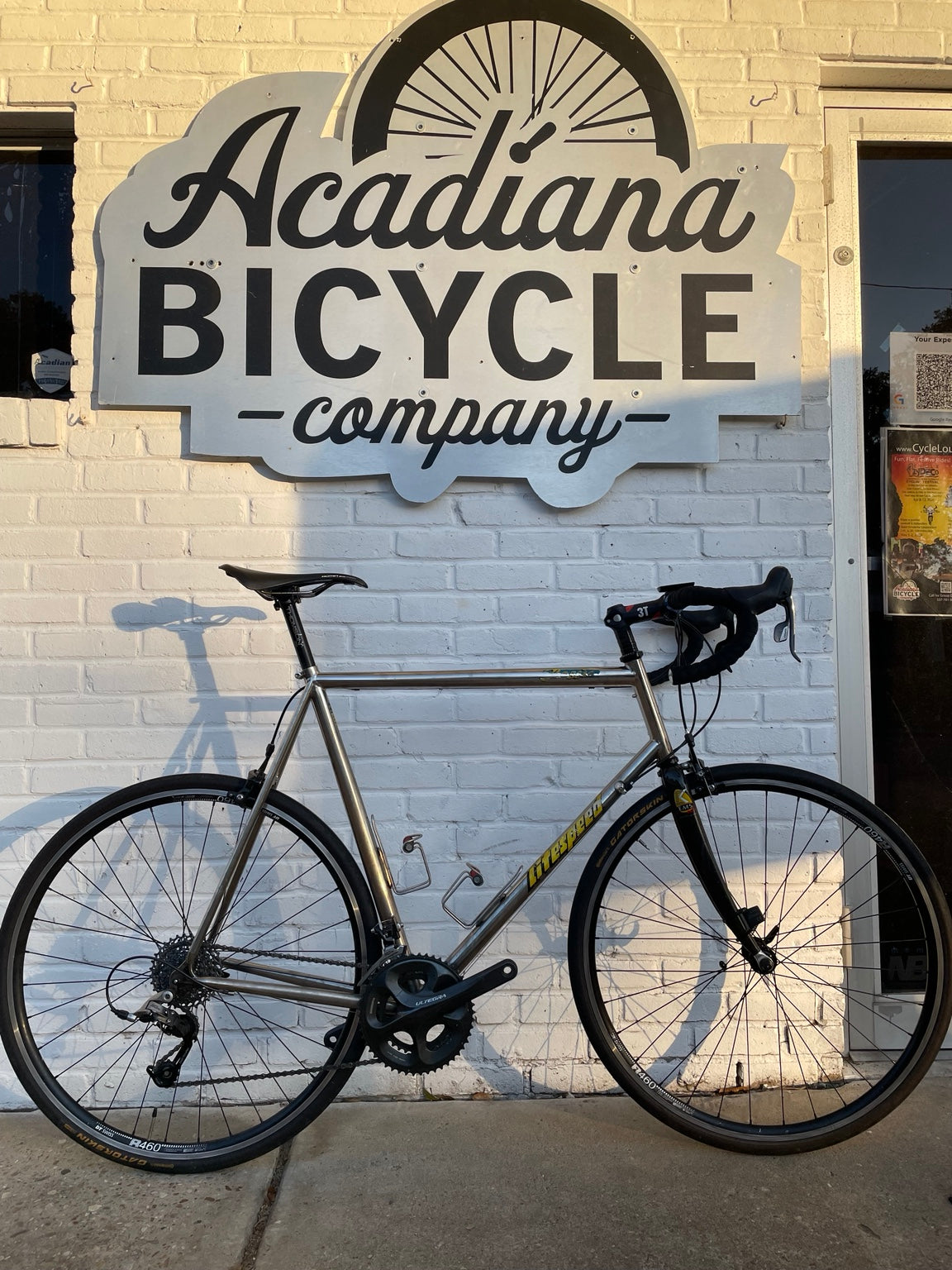 Litespeed Classic used titanium road bicycle outside Acadiana Bicycle Company
