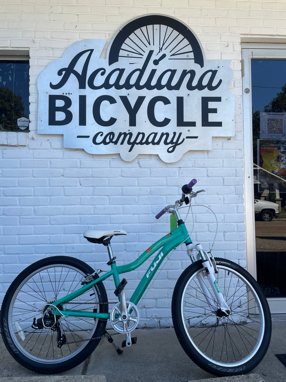 Used green Fuji Dynamite 24-inch kids bicycle at Acadiana Bicycle Company