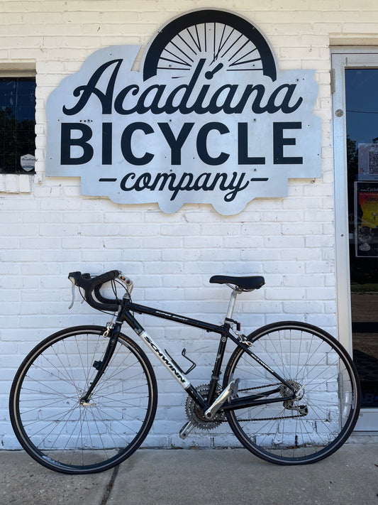 Used black Schwinn Super Sport road bicycle photographed outside Acadiana Bicycle Company